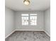 Carpeted bedroom with two windows at 222 Alton Cir, Villa Rica, GA 30180