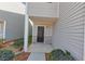 Close up of the entrance to a neutral sided townhome at 222 Alton Cir, Villa Rica, GA 30180