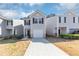 Charming townhome featuring a one-car garage and neutral siding at 222 Alton Cir, Villa Rica, GA 30180