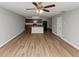 Spacious living area with wood flooring, connected to a modern kitchen with stainless steel appliances at 222 Alton Cir, Villa Rica, GA 30180
