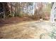 Backyard showing mature trees, patio, and space for gardening or outdoor activities, with room to roam at 3936 Toccoa Falls Dr, Duluth, GA 30097