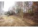 Wide backyard with flat grassy lawn and trees on the back property line at 3936 Toccoa Falls Dr, Duluth, GA 30097