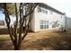 Backyard with a mature tree, flat yard and partially visible exterior of the home at 3936 Toccoa Falls Dr, Duluth, GA 30097