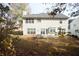 A view of the home's backyard, with a patio, bench and plenty of space for recreation at 3936 Toccoa Falls Dr, Duluth, GA 30097