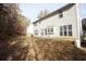 Large backyard with mature trees, with patio and lawn offering ample outdoor living and entertaining at 3936 Toccoa Falls Dr, Duluth, GA 30097