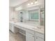 Bright bathroom with double sinks, large mirror, walk-in shower and a soaking tub at 3936 Toccoa Falls Dr, Duluth, GA 30097