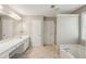 Large bathroom with double vanity, soaking tub, and a separate shower offers plenty of space at 3936 Toccoa Falls Dr, Duluth, GA 30097