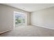 Carpeted bedroom features a large window offering natural light at 3936 Toccoa Falls Dr, Duluth, GA 30097