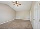 Cozy bedroom features a ceiling fan, plush carpet, and a neutral color scheme at 3936 Toccoa Falls Dr, Duluth, GA 30097