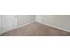 Bedroom featuring neutral walls and plush carpet with two doors leading to other rooms at 3936 Toccoa Falls Dr, Duluth, GA 30097