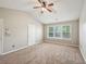 This comfortable bedroom has carpet and neutral walls with a window for natural light at 3936 Toccoa Falls Dr, Duluth, GA 30097