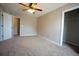 Comfortable carpeted bedroom with fan and easy access to closet and entry door at 3936 Toccoa Falls Dr, Duluth, GA 30097