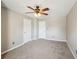 Bedroom with neutral walls, carpet, and a ceiling fan providing ample light at 3936 Toccoa Falls Dr, Duluth, GA 30097