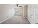 Light bedroom features carpeted floors, a ceiling fan and a large bright window at 3936 Toccoa Falls Dr, Duluth, GA 30097
