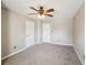 Bedroom featuring neutral walls and plush carpet with two doors leading to other rooms at 3936 Toccoa Falls Dr, Duluth, GA 30097