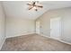 Spacious carpeted bedroom offers a ceiling fan and two doors for convenience at 3936 Toccoa Falls Dr, Duluth, GA 30097