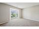 A light and airy bedroom with neutral carpet, large window and bay window at 3936 Toccoa Falls Dr, Duluth, GA 30097