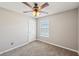 Bedroom featuring carpet, natural light and a ceiling fan at 3936 Toccoa Falls Dr, Duluth, GA 30097