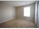 Comfortable bedroom with carpet flooring, white trim and a bright window at 3936 Toccoa Falls Dr, Duluth, GA 30097