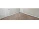 Clean bedroom with light carpet and multiple entry doors, allowing for many uses at 3936 Toccoa Falls Dr, Duluth, GA 30097