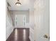 Open foyer with hardwood floors, wainscoting, and a view of the staircase and front door at 3936 Toccoa Falls Dr, Duluth, GA 30097