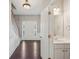 Stylish home foyer with hardwood floors, a staircase, a powder room, and elegant trim work at 3936 Toccoa Falls Dr, Duluth, GA 30097