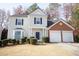Charming two-story home with a two-car garage, well-maintained landscaping, and a welcoming front entrance at 3936 Toccoa Falls Dr, Duluth, GA 30097