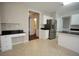 Kitchen area featuring granite countertops, stainless steel appliances and a center island, leading into an open layout at 3936 Toccoa Falls Dr, Duluth, GA 30097