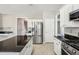A lovely kitchen with an island, stainless steel appliances, and granite countertops at 3936 Toccoa Falls Dr, Duluth, GA 30097