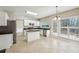 Eat-in kitchen features stainless appliances, tile flooring, center island, and access to the backyard patio at 3936 Toccoa Falls Dr, Duluth, GA 30097