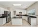 Bright open kitchen with granite countertops, tile flooring, stainless steel appliances and kitchen island at 3936 Toccoa Falls Dr, Duluth, GA 30097