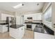 Updated eat-in kitchen with stainless steel appliances, granite countertops, tile floors, and a kitchen island at 3936 Toccoa Falls Dr, Duluth, GA 30097