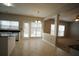 Kitchen area with tile flooring, a window, and an open design leading to the living room at 3936 Toccoa Falls Dr, Duluth, GA 30097