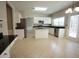 Spacious kitchen with granite countertops, stainless steel appliances, a center island, and lots of natural light at 3936 Toccoa Falls Dr, Duluth, GA 30097