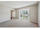 An open-concept living room offers bay window and plush carpeting at 3936 Toccoa Falls Dr, Duluth, GA 30097