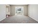 An open-concept living room offers bay window and plush carpeting at 3936 Toccoa Falls Dr, Duluth, GA 30097