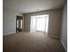 Bright living room featuring large bay window, neutral paint and carpet at 3936 Toccoa Falls Dr, Duluth, GA 30097