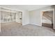 Open-concept living room with updated carpet and ample natural light at 3936 Toccoa Falls Dr, Duluth, GA 30097