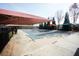 Community pool with a safety cover is surrounded by shade structures to create a comfortable and relaxing atmosphere at 3936 Toccoa Falls Dr, Duluth, GA 30097
