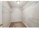 Walk-in Closet features carpet, white walls, and installed white wire racks at 3936 Toccoa Falls Dr, Duluth, GA 30097