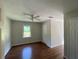 Well-lit bedroom with wood floors and window views at 728 Slew Ave, Lawrenceville, GA 30043