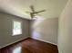 Cozy bedroom featuring hardwood floors and a bright window at 728 Slew Ave, Lawrenceville, GA 30043