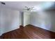 This bedroom features wood flooring, a ceiling fan, white walls and a closet with bi-fold doors at 728 Slew Ave, Lawrenceville, GA 30043