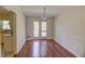 Bright dining room with access to the deck via double doors at 728 Slew Ave, Lawrenceville, GA 30043