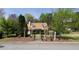Charming home featuring a landscaped front yard, sidewalk, and mature trees at 728 Slew Ave, Lawrenceville, GA 30043