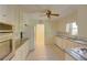 Bright kitchen features white cabinets, tile flooring, and granite countertops, perfect for cooking and entertaining at 728 Slew Ave, Lawrenceville, GA 30043