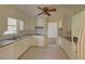 Traditional kitchen with white cabinets, a window and sleek granite countertops at 728 Slew Ave, Lawrenceville, GA 30043