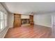 Spacious living room boasts a fireplace, built-in shelves, and laminate wood flooring at 728 Slew Ave, Lawrenceville, GA 30043