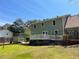 The rear exterior features neutral siding, a wooden deck, and a storage shed at 728 Slew Ave, Lawrenceville, GA 30043