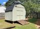 Exterior view of shed, featuring a wooden ramp and double doors at 728 Slew Ave, Lawrenceville, GA 30043